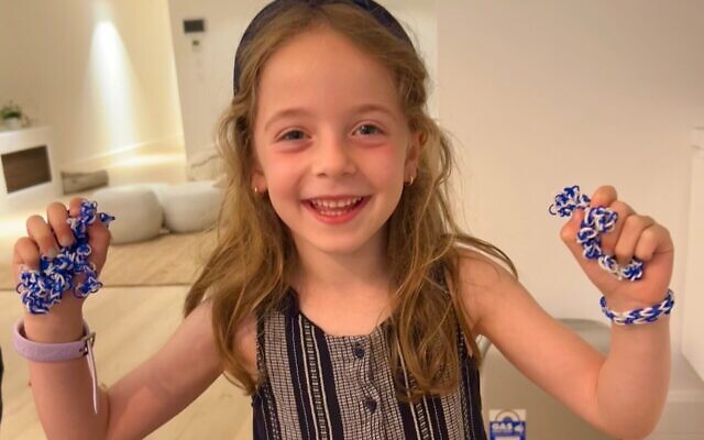 Sloane holding just a few of the loom bracelets she has been making to raise money for Israel. Sloane holding just a few of the loom bracelets she has been making to raise money for Israel.