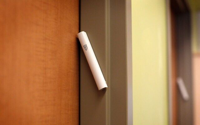 The mezuzah contains a passage from the Torah commanding Jews to inscribe the words on the doorposts of their homes. (Marta Iwanek/Toronto Star via Getty Images). The mezuzah contains a passage from the Torah commanding Jews to inscribe the words on the doorposts of their homes. (Marta Iwanek/Toronto Star via Getty Images).