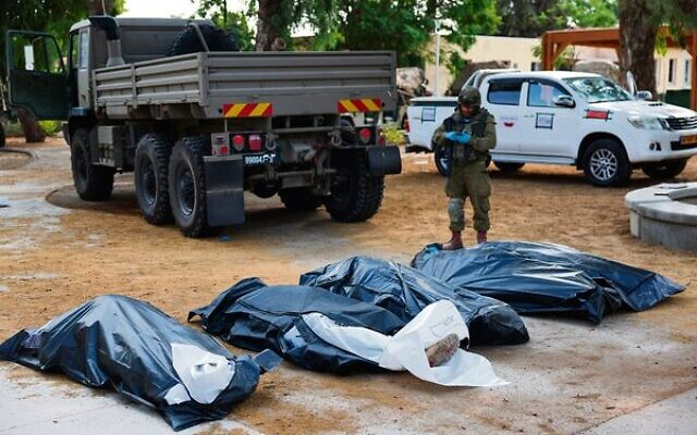 An IDF soldier prepares to remove the bodies of Israelis killed during the October 7 attack by Palestinian terrorists in Kibbutz Kfar Aza in southern Israel. Photo: Jack Guez/AFP An IDF soldier prepares to remove the bodies of Israelis killed during the October 7 attack by Palestinian terrorists in Kibbutz Kfar Aza in southern Israel. Photo: Jack Guez/AFP