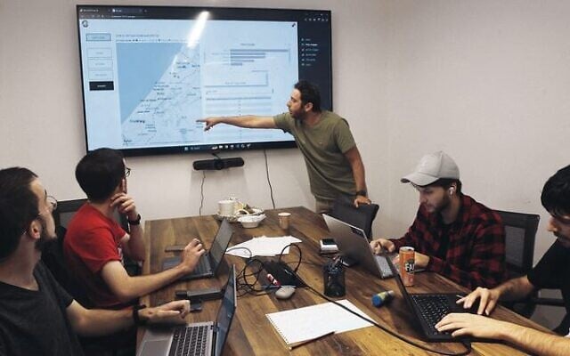 Volunteers at the offices of Gitam BBDO in Tel Aviv on October 25.
Photo: Gil Cohen-Magen/AFP Volunteers at the offices of Gitam BBDO in Tel Aviv on October 25.
Photo: Gil Cohen-Magen/AFP
