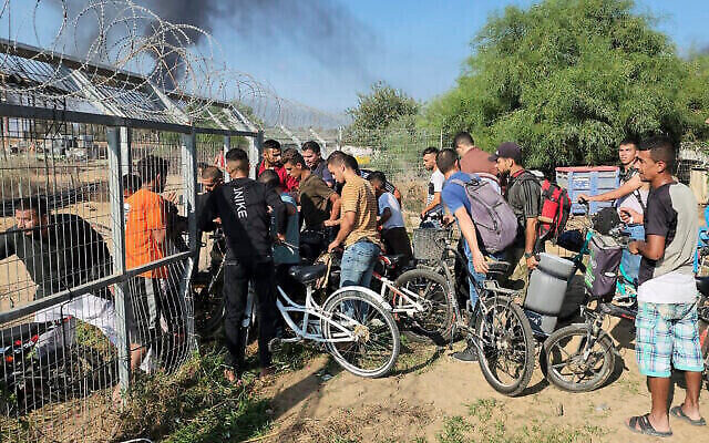 Palestinians from the Gaza Strip enter Kibbutz Kfar Aza on Oct. 7, 2023, amid a massive assault by the Hamas terror group. (The Times of Israel: AP Photo/Hassan Eslaiah) Palestinians from the Gaza Strip enter Kibbutz Kfar Aza on Oct. 7, 2023, amid a massive assault by the Hamas terror group. (The Times of Israel: AP Photo/Hassan Eslaiah)