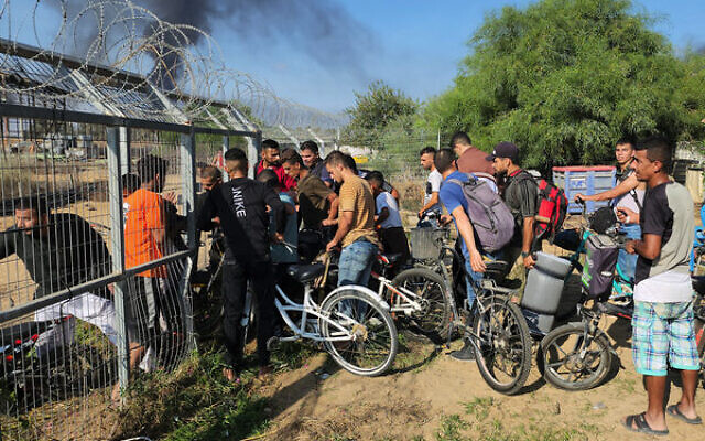 A photo by Hassan Eslaiah shows Gazans entering Kibbutz Kfar Aza on October 7. Photo: AP Photo/Hassan Eslaiah A photo by Hassan Eslaiah shows Gazans entering Kibbutz Kfar Aza on October 7. Photo: AP Photo/Hassan Eslaiah