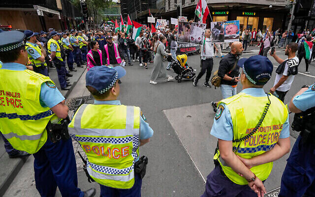 Police watch as protesters march during a pro-Palestinian rally in Sydney, Australia, Saturday, Nov. 4, 2023. (The Times of Israel: AP/Mark Baker) Police watch as protesters march during a pro-Palestinian rally in Sydney, Australia, Saturday, Nov. 4, 2023. (The Times of Israel: AP/Mark Baker)
