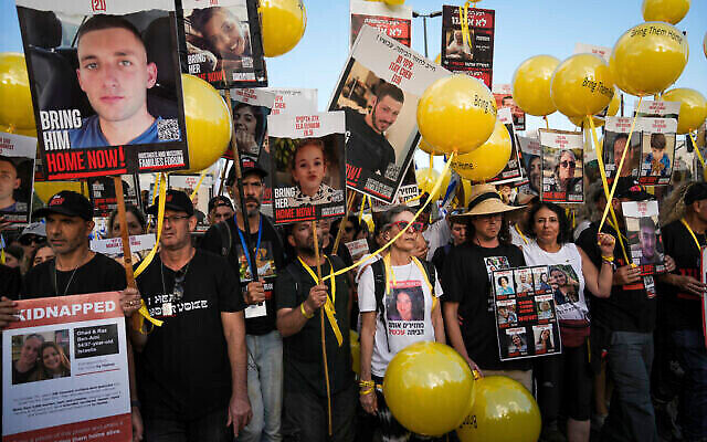 Family and supporters of the estimated 240 hostages held by Hamas in Gaza complete the final leg of a five-day solidarity rally calling for their return, from Tel Aviv to the Prime Minister's Office in Jerusalem, November 18, 2023. (The Times of Israel: AP/Mahmoud Illean) Family and supporters of the estimated 240 hostages held by Hamas in Gaza complete the final leg of a five-day solidarity rally calling for their return, from Tel Aviv to the Prime Minister's Office in Jerusalem, November 18, 2023. (The Times of Israel: AP/Mahmoud Illean)