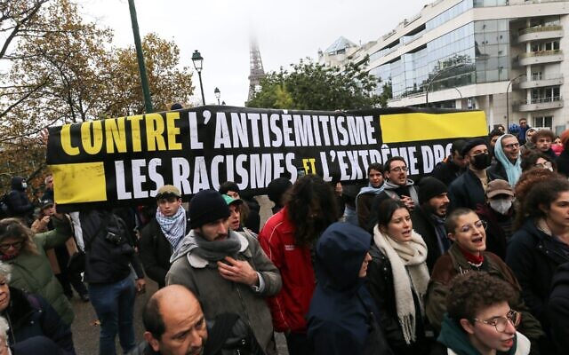 Demonstrators carry a banner reading "Against antisemitism, racism and the extreme right" during a rally at the Square des Martyrs Juifs in Paris, Nov. 12, 2023. (The Times of Israel: Michel Stoupak/NurPhoto via Getty Images) Demonstrators carry a banner reading "Against antisemitism, racism and the extreme right" during a rally at the Square des Martyrs Juifs in Paris, Nov. 12, 2023. (The Times of Israel: Michel Stoupak/NurPhoto via Getty Images)