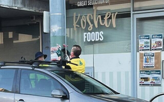 Glen Eira City Council workers removing a "Kidnapped" poster on Hawthorn Rd. Glen Eira City Council workers removing a "Kidnapped" poster on Hawthorn Rd.