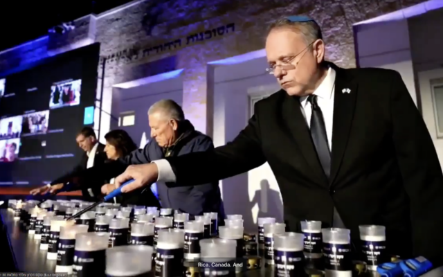 Participants in a ceremony in Jerusalem tied to shloshim, the 30-day mark after a Jewish death, light memorial candles on Sunday, Nov. 5, 2023. (Screenshot) Participants in a ceremony in Jerusalem tied to shloshim, the 30-day mark after a Jewish death, light memorial candles on Sunday, Nov. 5, 2023. (Screenshot)