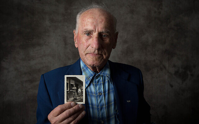Jack Meister holding a photo of himself, taken at the liberation of Buchenwald in April 1945. Photo: Sydney Jewish Museum Jack Meister holding a photo of himself, taken at the liberation of Buchenwald in April 1945. Photo: Sydney Jewish Museum
