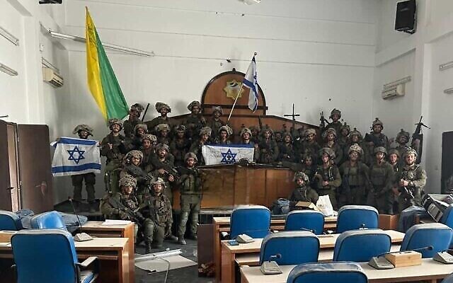 Troops from the IDF's Golani Brigade pose for a photo inside Gaza's parliament building in Gaza City, after capturing the site, on November 13, 2023. (The Times of Israel: Social media; used in accordance with Clause 27a of the Copyright Law) Troops from the IDF's Golani Brigade pose for a photo inside Gaza's parliament building in Gaza City, after capturing the site, on November 13, 2023. (The Times of Israel: Social media; used in accordance with Clause 27a of the Copyright Law)