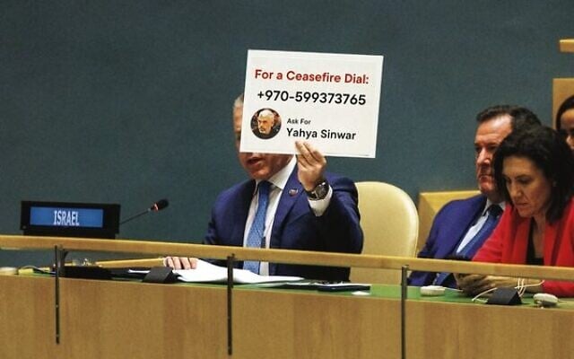 Israel's ambassador to the UN Gilad Erdan holds up a sign while speaking during the UN General Assembly on Tuesday. A motion calling for an immediate ceasefire passed 153-10, with Australia voting in favour. Photo: EPA/Sarah Yenesel Israel's ambassador to the UN Gilad Erdan holds up a sign while speaking during the UN General Assembly on Tuesday. A motion calling for an immediate ceasefire passed 153-10, with Australia voting in favour. Photo: EPA/Sarah Yenesel