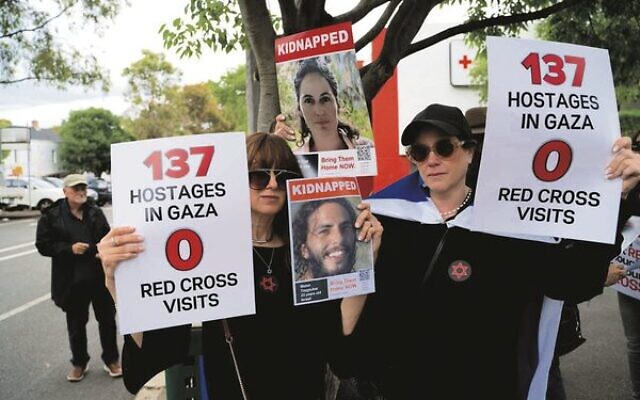 Protesters outside the offices of the Australian Red Cross in Melbourne last Thursday. Protesters outside the offices of the Australian Red Cross in Melbourne last Thursday.