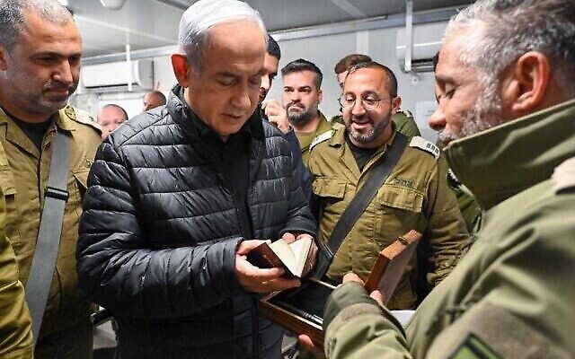 Prime Minister Benjamin Netanyahu visits a detention facility in southern Israel where Hamas operatives detained in the Gaza Strip are being questioned by the IDF's 504 human intelligence unit, December 13, 2023. (The Times of Israel: Kobi Gideon/GPO) Prime Minister Benjamin Netanyahu visits a detention facility in southern Israel where Hamas operatives detained in the Gaza Strip are being questioned by the IDF's 504 human intelligence unit, December 13, 2023. (The Times of Israel: Kobi Gideon/GPO)