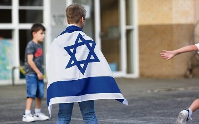 A child wears an Israeli flag at the "Lights of Hope" event last in Sydney last Thursday night. Photo: Vicki Lauren Photography A child wears an Israeli flag at the "Lights of Hope" event last in Sydney last Thursday night. Photo: Vicki Lauren Photography