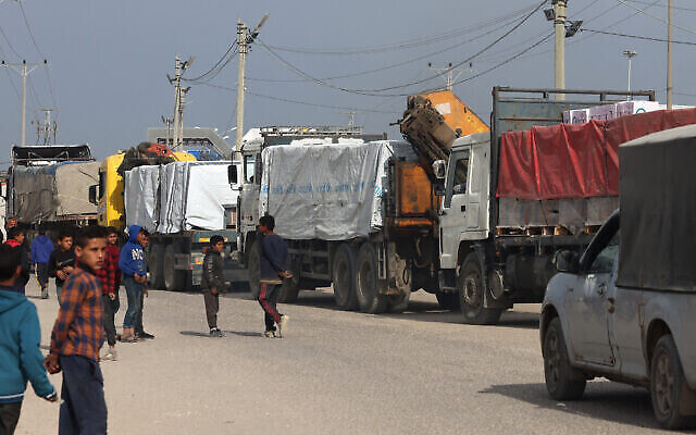 Trucks carrying humanitarian aid enter Rafah in the southern Gaza Strip after crossing the terminal border from Egypt, on January 17, 2024, during the ongoing war between Israel and the Palestinian terror group Hamas. (The Times of Israel: AFP) Trucks carrying humanitarian aid enter Rafah in the southern Gaza Strip after crossing the terminal border from Egypt, on January 17, 2024, during the ongoing war between Israel and the Palestinian terror group Hamas. (The Times of Israel: AFP)
