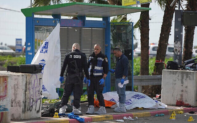 The body of a terrorist lies at a bus stop as Israeli police investigate the site of a terror shooting attack at the Re'em junction near Kiryat Malakhi in southern Israel, Friday, Feb. 16, 2024. (The Times of Israel: AP Photo/Tsafrir Abayov) The body of a terrorist lies at a bus stop as Israeli police investigate the site of a terror shooting attack at the Re'em junction near Kiryat Malakhi in southern Israel, Friday, Feb. 16, 2024. (The Times of Israel: AP Photo/Tsafrir Abayov)