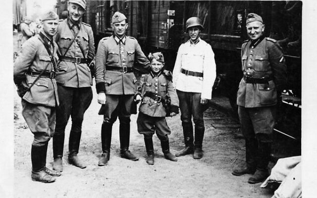 Alex Kurzem with Latvian battalion members. Photo: SBS Alex Kurzem with Latvian battalion members. Photo: SBS