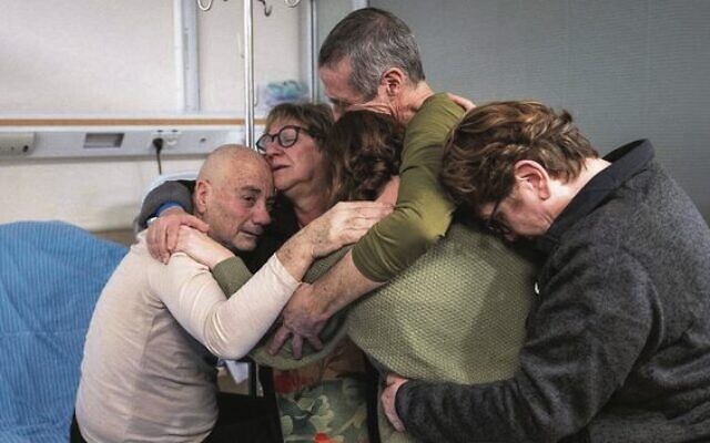 Louis Har (left) and Fernando Marman (second from right) are reunited with loved ones at Sheba Medical Centre, February 12, 2024. Photo: Israel Defence Forces Louis Har (left) and Fernando Marman (second from right) are reunited with loved ones at Sheba Medical Centre, February 12, 2024. Photo: Israel Defence Forces