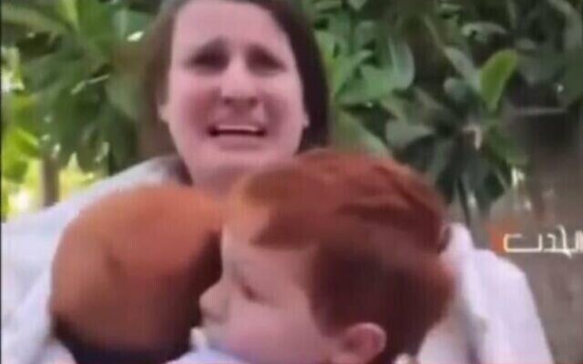 Shiri Bibas and her sons Ariel, 4, and baby Kfir, are abducted from Kibbutz Nir Oz by Hamas terrorists on October 7, 2023. (The Times of Israel: Screenshot) Shiri Bibas and her sons Ariel, 4, and baby Kfir, are abducted from Kibbutz Nir Oz by Hamas terrorists on October 7, 2023. (The Times of Israel: Screenshot)
