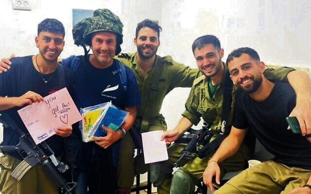 Danny Hochberg (second from left) delivers cards from Australian well-wishers to IDF troops in October last year. Danny Hochberg (second from left) delivers cards from Australian well-wishers to IDF troops in October last year.