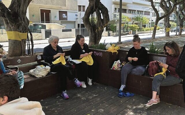 Israeli women in Tel Aviv knitting tree huggers Israeli women in Tel Aviv knitting tree huggers