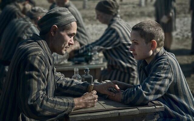 The Tattooist of Auschwitz – a young Lale Sokolov (Jonah Hauer-King) with Gita Furman (Anna Próchniak). The Tattooist of Auschwitz – a young Lale Sokolov (Jonah Hauer-King) with Gita Furman (Anna Próchniak).