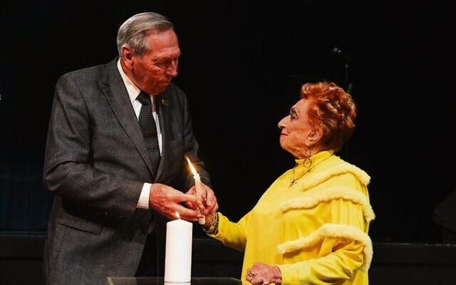 Jan Anger and Lilly Wolf lighting a commemorative candle. Photo: Giselle Haber Jan Anger and Lilly Wolf lighting a commemorative candle. Photo: Giselle Haber