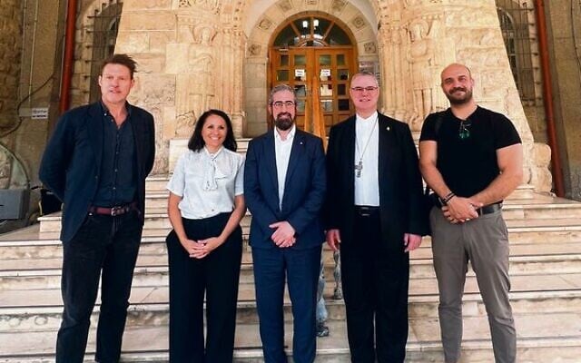 Rabbi Yaakov Glasman (centre) and Archbishop Peter Comensoli (second from right) with leaders of the Augusta Victoria Hospital in East Jerusalem. Rabbi Yaakov Glasman (centre) and Archbishop Peter Comensoli (second from right) with leaders of the Augusta Victoria Hospital in East Jerusalem.