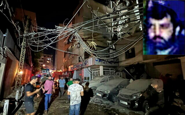 People gather near a destroyed building that was hit by an Israeli airstrike in the southern suburbs of Beirut, Lebanon, July 30, 2024.; inset: Top Hezbollah commander Fuad Shukr in a US wanted poster (The Times of Israel: AP Photo/Hussein Malla; State Department) People gather near a destroyed building that was hit by an Israeli airstrike in the southern suburbs of Beirut, Lebanon, July 30, 2024.; inset: Top Hezbollah commander Fuad Shukr in a US wanted poster (The Times of Israel: AP Photo/Hussein Malla; State Department)