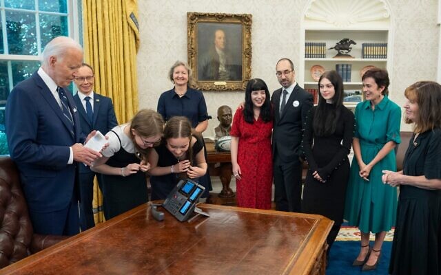 The family of Evan Gershkovich (sister Danielle, in red; brother-in-law Anthony Huczek, fourth from right; mother Ella, furthest right; father Mikhail, out of frame) and other families of recently freed dissidents, journalists, and activists held in Russia in a massive prisoner exchange, meet with President Joe Biden in the Oval Office. (Official White House Photo by Adam Schultz) The family of Evan Gershkovich (sister Danielle, in red; brother-in-law Anthony Huczek, fourth from right; mother Ella, furthest right; father Mikhail, out of frame) and other families of recently freed dissidents, journalists, and activists held in Russia in a massive prisoner exchange, meet with President Joe Biden in the Oval Office. (Official White House Photo by Adam Schultz)