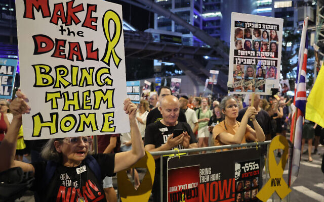 Demonstrators attend an anti-government protest calling for action to release the Israeli hostages held captive in Gaza, in front of the Israeli Defense Ministry in Tel Aviv, September 12, 2024. (The Times of Israel: Jack Guez/AFP)