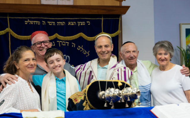 Rabbi Yonatan Sadoff is pictured centre with congregants. Rabbi Yonatan Sadoff is pictured centre with congregants.