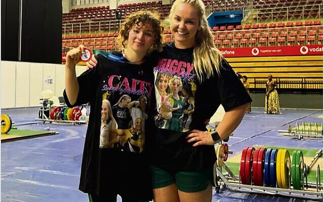 Ashley Kolomoisky wearing her bronze medal next to her coach Caity Haniver at the 2024 Commonwealth Weightlifting Championships. Ashley Kolomoisky wearing her bronze medal next to her coach Caity Haniver at the 2024 Commonwealth Weightlifting Championships.