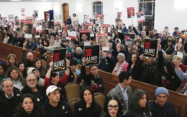 Mourners hold placards calling for the release of the remaining hostages at a memorial service at Caulfield Shule for the six hostages found murdered in Gaza. Photo: Peter Haskin Mourners hold placards calling for the release of the remaining hostages at a memorial service at Caulfield Shule for the six hostages found murdered in Gaza. Photo: Peter Haskin