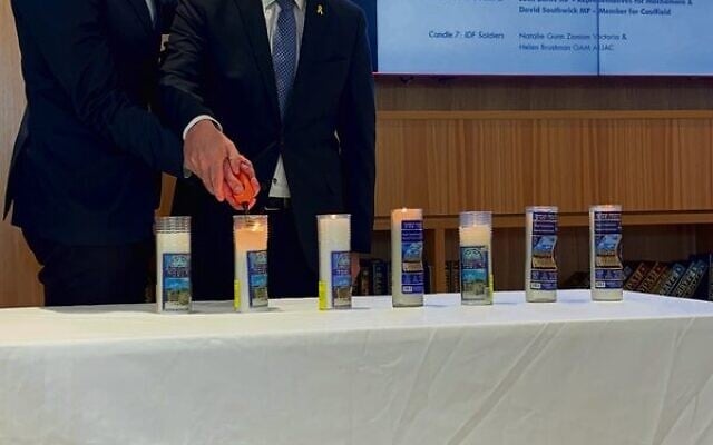 Josh Burns MP and David Southwick MP light a memorial candle together on October 7, 2024. Josh Burns MP and David Southwick MP light a memorial candle together on October 7, 2024.