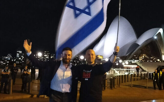 Rabbi Yossi Friedman (left) and Ofir Birenbaum with an Israeli flag, after the event concluded. The Sydney Opera House can be seen in the background. Rabbi Yossi Friedman (left) and Ofir Birenbaum with an Israeli flag, after the event concluded. The Sydney Opera House can be seen in the background.