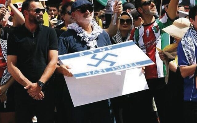 Owner of Nomad Alan Yazbek with his offensive sign. Owner of Nomad Alan Yazbek with his offensive sign.