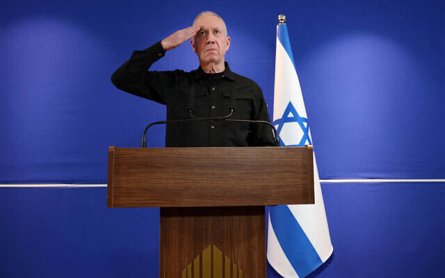 Defense Minister Yoav Gallant salutes as a sign of respect to Israel's security forces at the end of a press conference and after he was fired by Prime Minister Benjamin Netanyahu, at the Ministry of Defense in Tel Aviv, November 5, 2024. (The Times of Israel: Reuters/Nir Elias) Defense Minister Yoav Gallant salutes as a sign of respect to Israel's security forces at the end of a press conference and after he was fired by Prime Minister Benjamin Netanyahu, at the Ministry of Defense in Tel Aviv, November 5, 2024. (The Times of Israel: Reuters/Nir Elias)