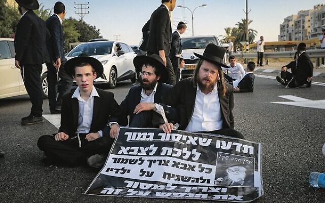 Ultra-Orthodox men protest against the military draft outside Bnei Brak.
Photo: Jamal Awad/Flash90 Ultra-Orthodox men protest against the military draft outside Bnei Brak.
Photo: Jamal Awad/Flash90