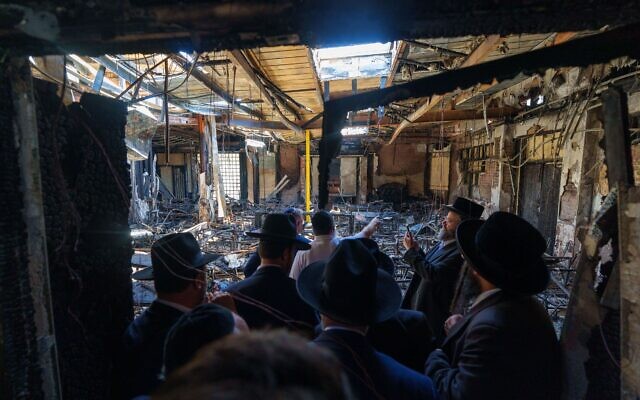 Prime Minister Anthony Albanese surveys the damage to the firebombed Adass Israel synagogue with members of the community. Photo Prime Minister's Department Prime Minister Anthony Albanese surveys the damage to the firebombed Adass Israel synagogue with members of the community. Photo Prime Minister's Department