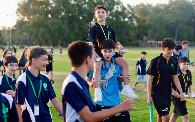 Members of the NSW, Victoria, and Western Australia teams bond after another afternoon of sport at the 2025 Maccabi Junior Carnival in Perth. Photo: Maccabi Members of the NSW, Victoria, and Western Australia teams bond after another afternoon of sport at the 2025 Maccabi Junior Carnival in Perth. Photo: Maccabi