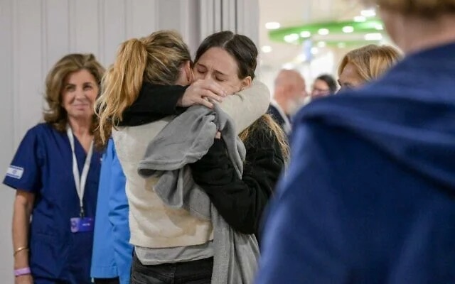 Doron Steinbrecher (in black) reunites with her family at Sheba Medical Center in Ramat Gan, January 19, 2025. (The Time of Israel: Maayan Toaf/GPO) Doron Steinbrecher (in black) reunites with her family at Sheba Medical Center in Ramat Gan, January 19, 2025. (The Time of Israel: Maayan Toaf/GPO)