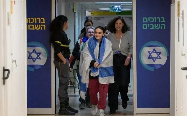 Emily Damari walks in to meet her family members at the Tel Hashomer Hospital in Ramat Gan, January 19, 2025. (Maayan Toaf/GPO) Emily Damari walks in to meet her family members at the Tel Hashomer Hospital in Ramat Gan, January 19, 2025. (Maayan Toaf/GPO)