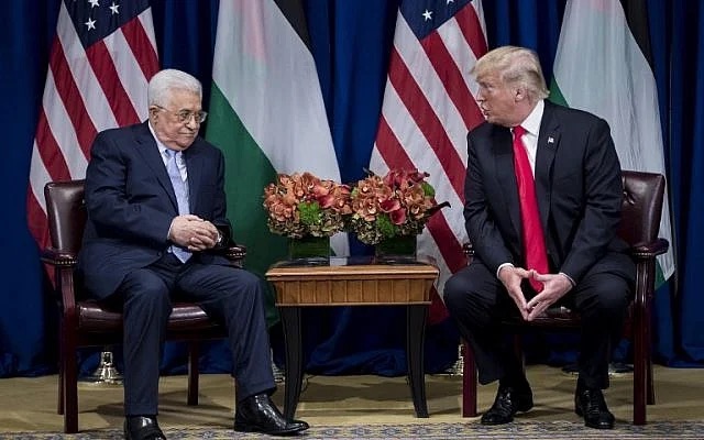 Palestinian Authority President Mahmoud Abbas listens while then-US President Donald Trump makes a statement for the press before a meeting at the Palace Hotel during the 72nd United Nations General Assembly on September 20, 2017, in New York. (The Times of Israel: AFP/Brendan Smialowski/ File) Palestinian Authority President Mahmoud Abbas listens while then-US President Donald Trump makes a statement for the press before a meeting at the Palace Hotel during the 72nd United Nations General Assembly on September 20, 2017, in New York. (The Times of Israel: AFP/Brendan Smialowski/ File)