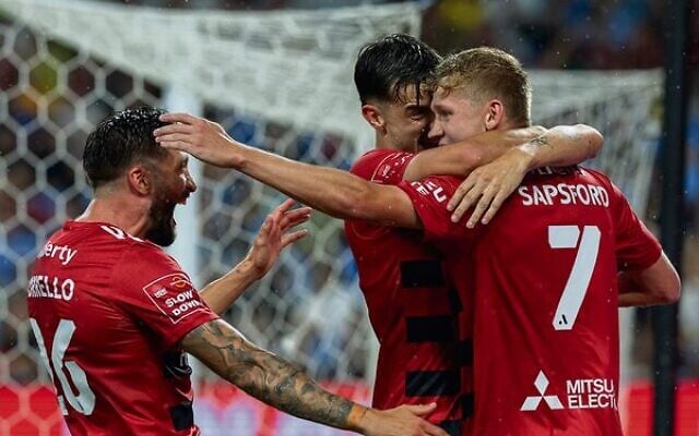 Zac Sapsford (right) being congratulated by Wanderers teammates after scoring two goals against Sydney FC last Saturday night at Allianz Stadium. Photo: Steve Christos/A-Leagues Zac Sapsford (right) being congratulated by Wanderers teammates after scoring two goals against Sydney FC last Saturday night at Allianz Stadium. Photo: Steve Christos/A-Leagues