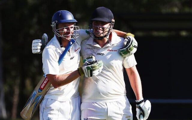Benji Jones (left) and his brother Josh embrace last Sunday after the former's last innings for Maccabi-AJAX. Photo: Peter Haskin Benji Jones (left) and his brother Josh embrace last Sunday after the former's last innings for Maccabi-AJAX. Photo: Peter Haskin