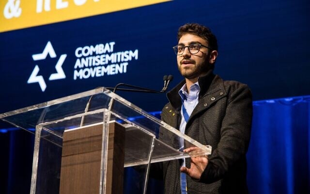 AUJS UTS president Moshe Kadoury addresses the 'Rise & Respond Global Student Summit Against Antisemitism' in New York City, March 23, 2025. Photo: Courtesy AUJS UTS president Moshe Kadoury addresses the 'Rise & Respond Global Student Summit Against Antisemitism' in New York City, March 23, 2025. Photo: Courtesy