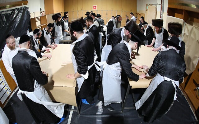 The Adass Israel community in Melbourne baking shmura matzah for Pesach. Photo: Peter Haskin. The Adass Israel community in Melbourne baking shmura matzah for Pesach. Photo: Peter Haskin.