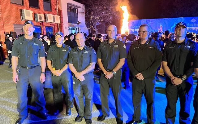Some of the Fire Rescue Victoria firefighters who fought the blaze after the firebombing of the Adass Israel synagogue in December, at the Lag b'Omer celebrations on Thursday night. Photo: Bruce Hill. Some of the Fire Rescue Victoria firefighters who fought the blaze after the firebombing of the Adass Israel synagogue in December, at the Lag b'Omer celebrations on Thursday night. Photo: Bruce Hill.