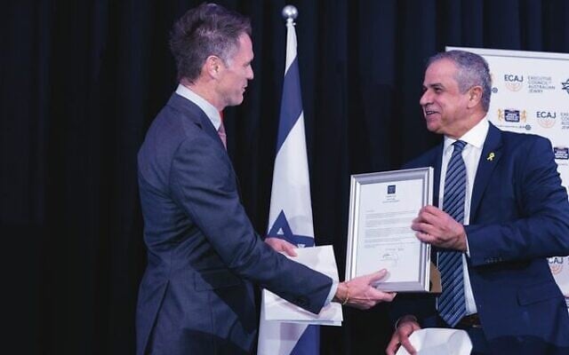 Israeli ambassador Amir Maimon (right) presents Premier Chris Minns with a framed copy of President Isaac Herzog's letter. Photo: Giselle Haber Israeli ambassador Amir Maimon (right) presents Premier Chris Minns with a framed copy of President Isaac Herzog's letter. Photo: Giselle Haber
