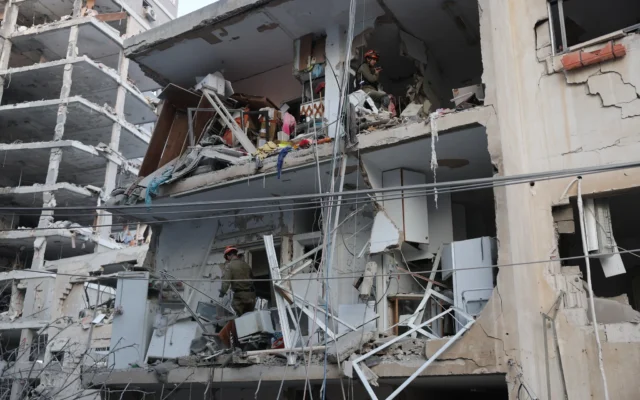 Responders work in a damaged building following a strike by an Iranian missile in the city of Bat Yam, south of Tel Aviv, early on June 15, 2025. (Jack Guez / AFP) Responders work in a damaged building following a strike by an Iranian missile in the city of Bat Yam, south of Tel Aviv, early on June 15, 2025. (Jack Guez / AFP)